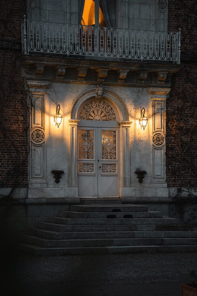 How to Improve Home Security With Better Locks Illuminated entrance with wall-mounted lights at night for home security