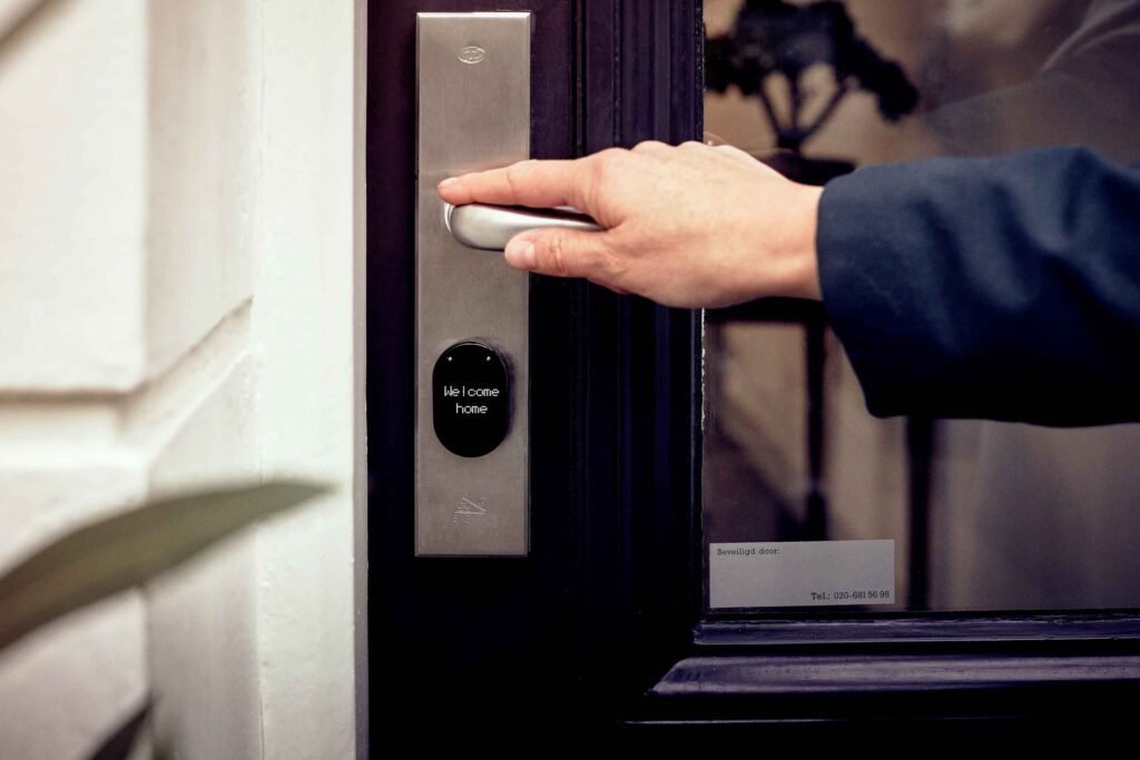 How to Improve Home Security With Better Locks Smart lock keypad installed on a home door for keyless entry