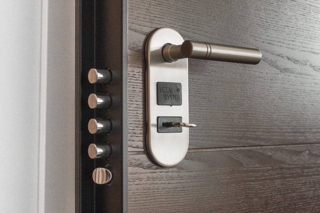 How to Improve Home Security With Better Locks Smart lock installed on a modern front door